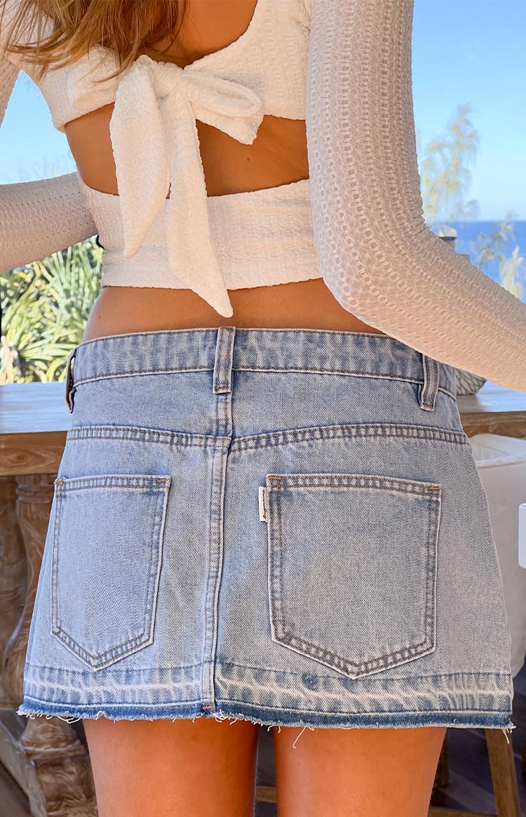 Emmy Light Wash Denim Distressed Mini Skirt — 9